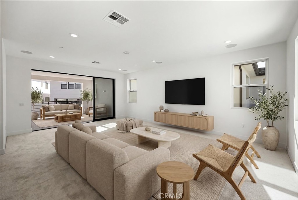 164 Apron Irvine, CA 92618 - Photo 42 of 67 a living room with furniture and a flat screen tv