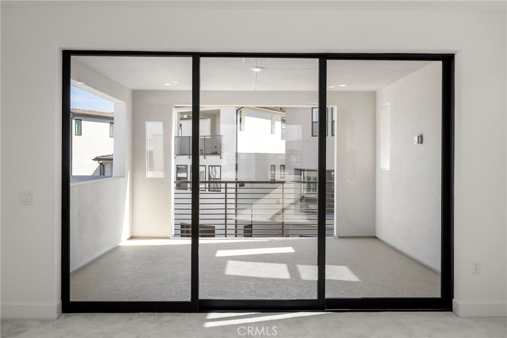 164 Apron Irvine, CA 92618 - Photo 53 of 67 a view of entryway with a floor to ceiling window and outdoor view
