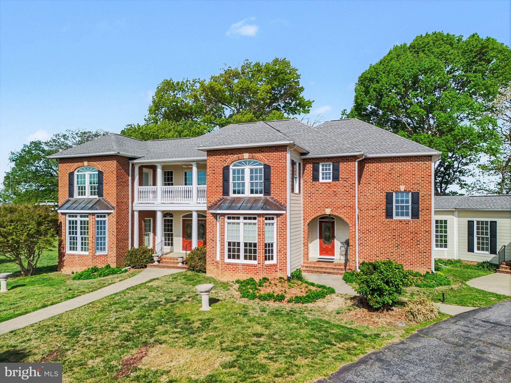 16186 Bundock Road King George, VA 22485 - Photo 4 of 82 Elegant brick home with lush greenery.