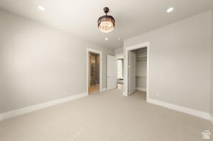 1141 East Lost Ridge Drive Washington, UT 84780 - Photo 105 of 108 Carpeted room featuring a decorative ceiling light fixture, recessed lighting, and a closet with bifold doors