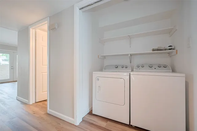 a view of wooden staircase with white walls