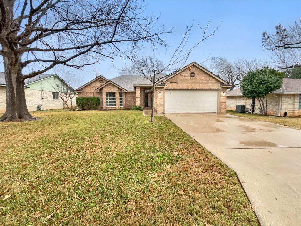 202 Rockmoor Drive Georgetown, TX 78628 - Photo 1 of 1 a front view of a house with a yard and garage