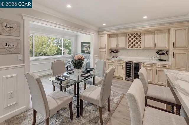 a view of a dining room with furniture window and outside view