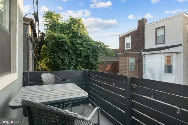 a view of outdoor sitting area with furniture