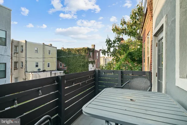 a view of a balcony with furniture