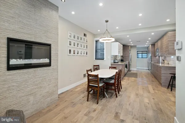 a kitchen with a table and chairs in it