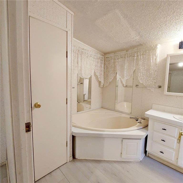 281 Mockingbird Drive Monticello, GA 31064 - Photo 30 of 42 a bathroom with a bathtub and a shower