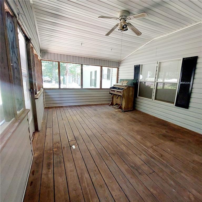 281 Mockingbird Drive Monticello, GA 31064 - Photo 4 of 42 a view of a livingroom with wooden floor and furniture