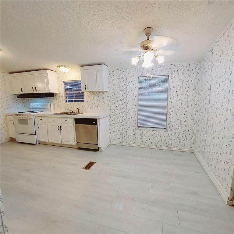 281 Mockingbird Drive Monticello, GA 31064 - Photo 10 of 42 a view of a kitchen with a sink and a window