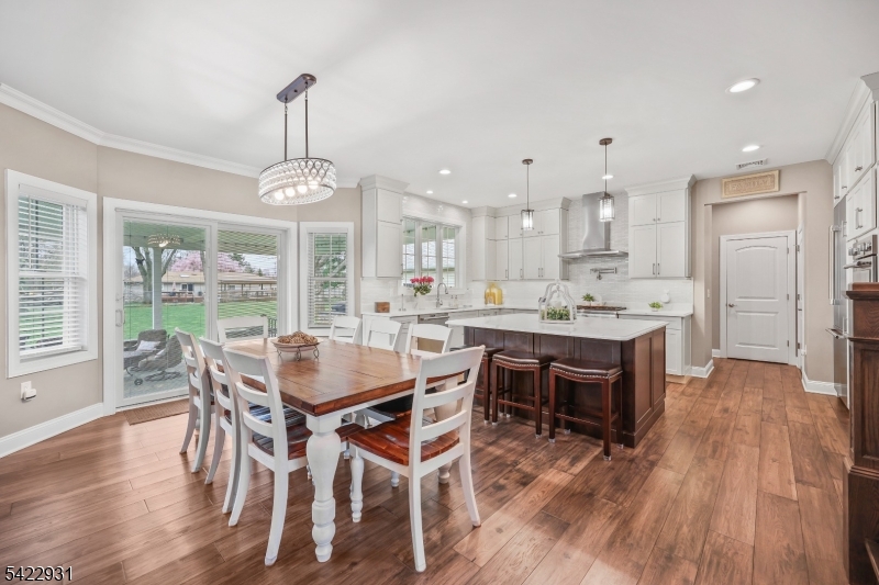 13 Fox Run Monroe Township, NJ 08831 - Photo 12 of 46 a view of a dining room and livingroom with furniture wooden floor a chandelier