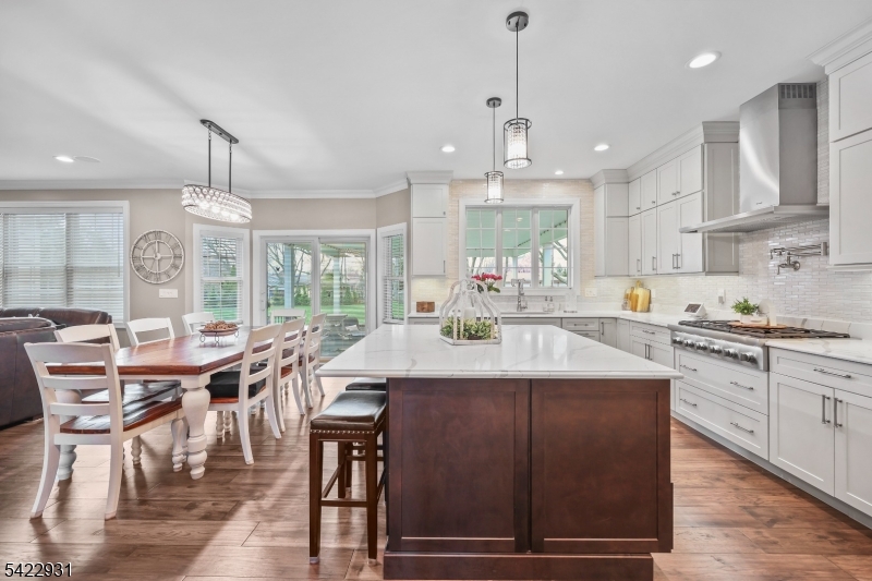 13 Fox Run Monroe Township, NJ 08831 - Photo 13 of 46 a kitchen with stainless steel appliances granite countertop a table chairs sink and cabinets