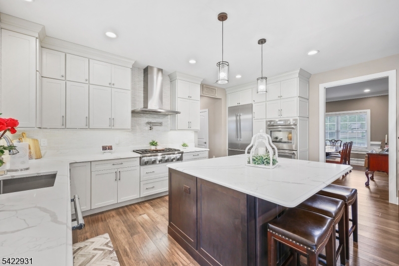 13 Fox Run Monroe Township, NJ 08831 - Photo 16 of 46 a large kitchen with kitchen island a island a sink a stove and a center island