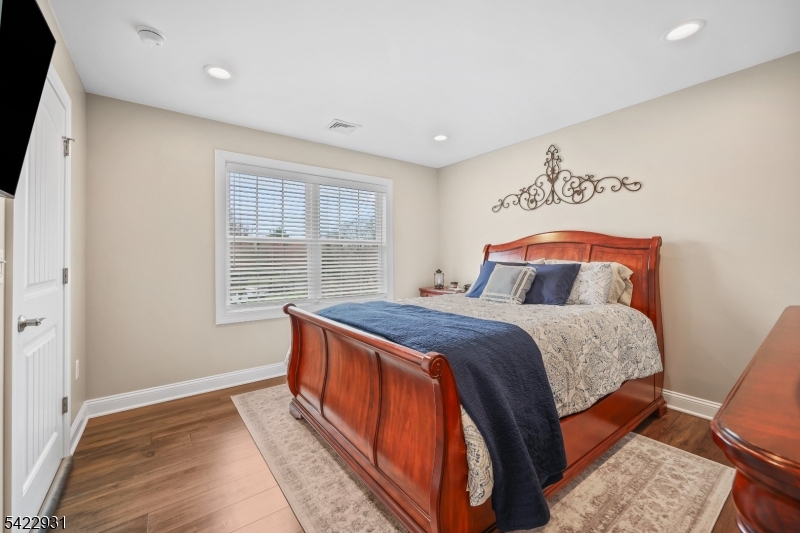 13 Fox Run Monroe Township, NJ 08831 - Photo 20 of 46 a bedroom with a bed and wooden floor