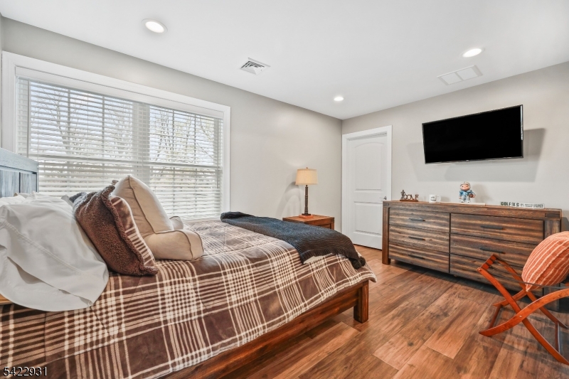 13 Fox Run Monroe Township, NJ 08831 - Photo 24 of 46 a bedroom with bed and flat screen tv