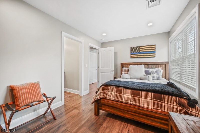 13 Fox Run Monroe Township, NJ 08831 - Photo 25 of 46 a bedroom with a bed and wooden floor