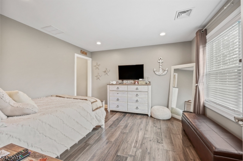13 Fox Run Monroe Township, NJ 08831 - Photo 29 of 46 a view of a bedroom with wooden floor