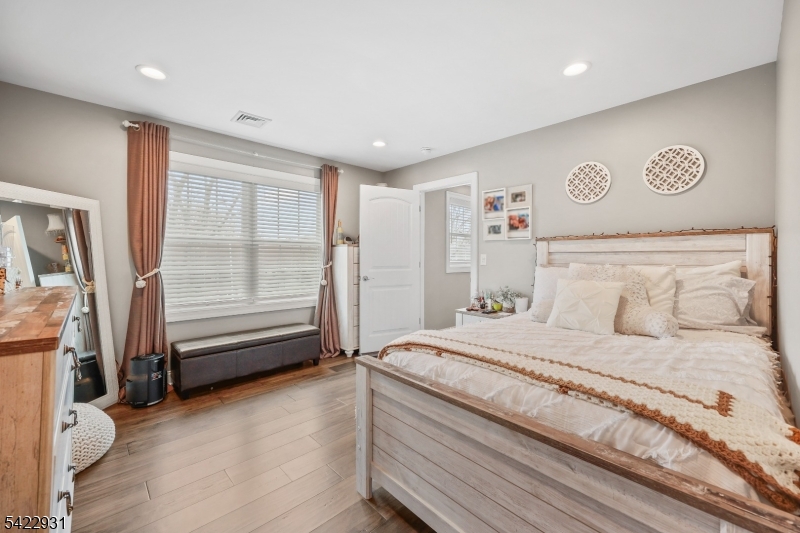13 Fox Run Monroe Township, NJ 08831 - Photo 30 of 46 a bedroom with a bed and a refrigerator