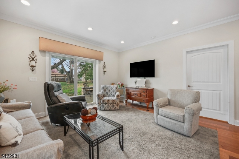 13 Fox Run Monroe Township, NJ 08831 - Photo 31 of 46 a living room with furniture and a flat screen tv