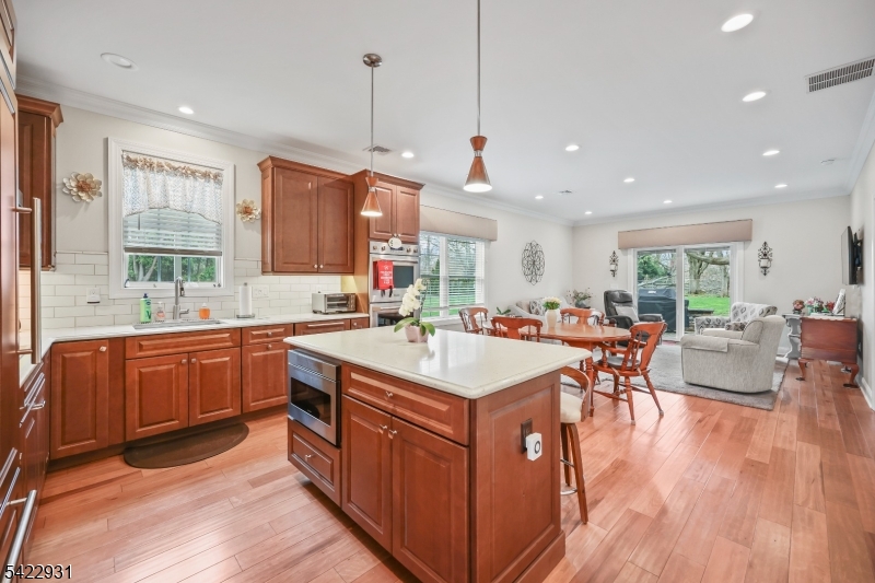 13 Fox Run Monroe Township, NJ 08831 - Photo 39 of 46 a large kitchen with kitchen island a sink a center island a table and chairs