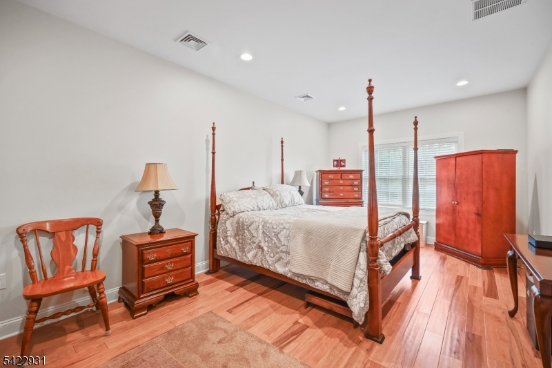 13 Fox Run Monroe Township, NJ 08831 - Photo 41 of 46 a spacious bedroom with a bed and wooden floor