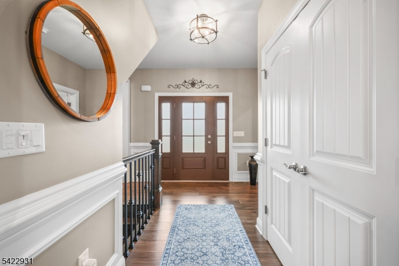 13 Fox Run Monroe Township, NJ 08831 - Photo 5 of 46 a hallway with windows and a chandelier