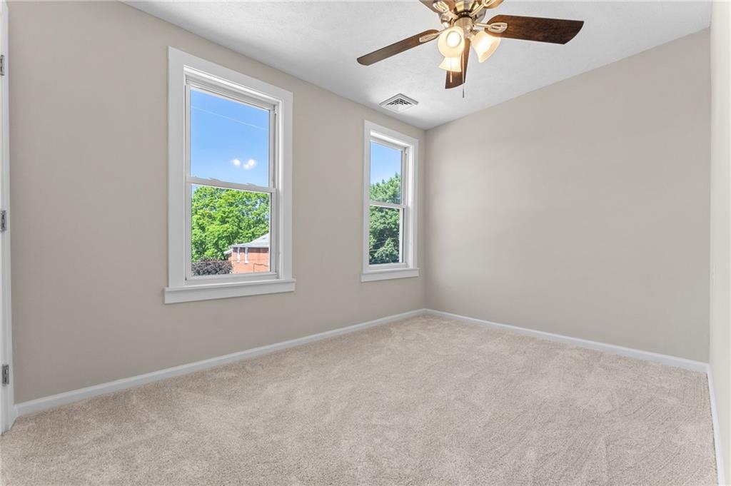 523 Cross Street Rochester, PA 15074 - Photo 31 of 41 an empty room with windows and fan