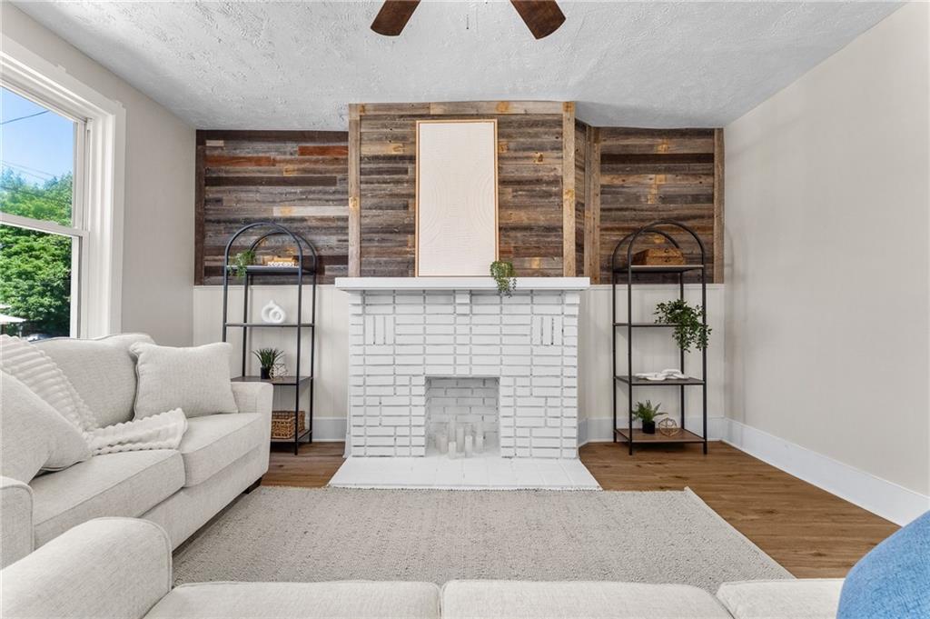 523 Cross Street Rochester, PA 15074 - Photo 6 of 41 a living room with furniture and a fireplace