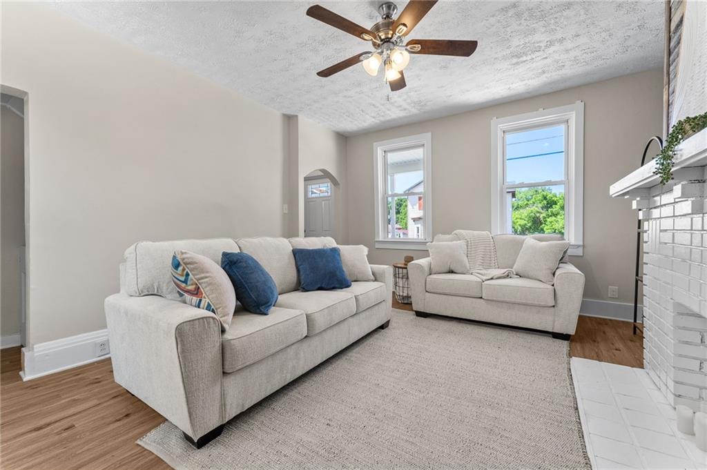 523 Cross Street Rochester, PA 15074 - Photo 7 of 41 a living room with furniture and a window