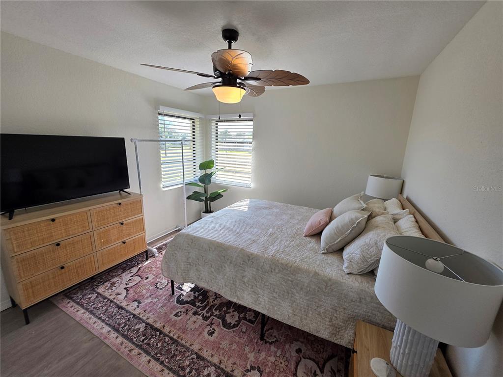 13 Seaward Circle Placida, FL 33946 - Photo 12 of 45 a bedroom with a bed and flat screen tv