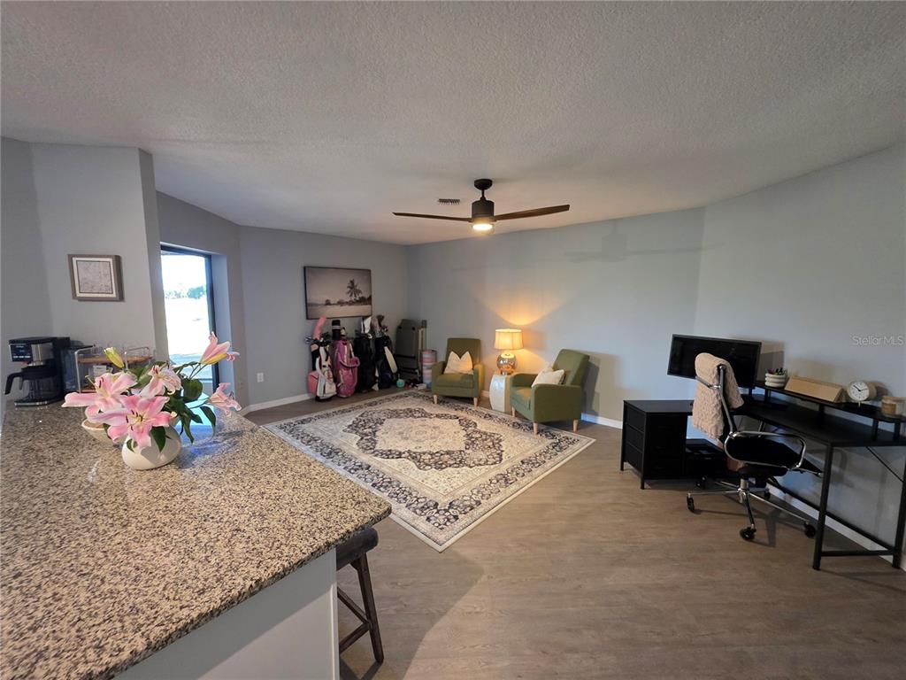 13 Seaward Circle Placida, FL 33946 - Photo 15 of 45 a living room with furniture and a chandelier