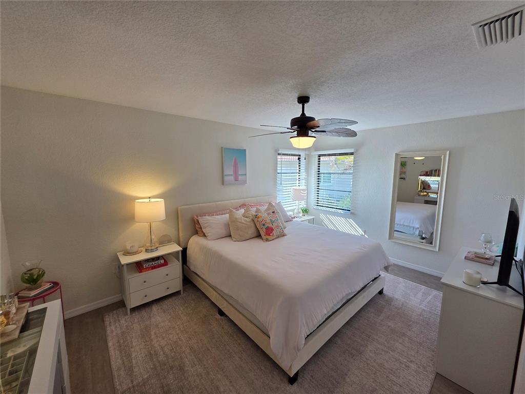 13 Seaward Circle Placida, FL 33946 - Photo 16 of 45 a bedroom with a bed and a chair in it
