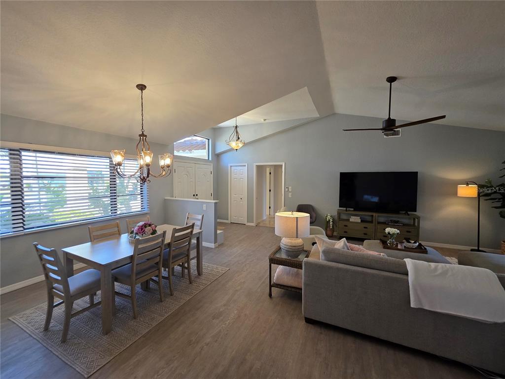 13 Seaward Circle Placida, FL 33946 - Photo 25 of 45 a living room with furniture a flat screen tv and a chandelier