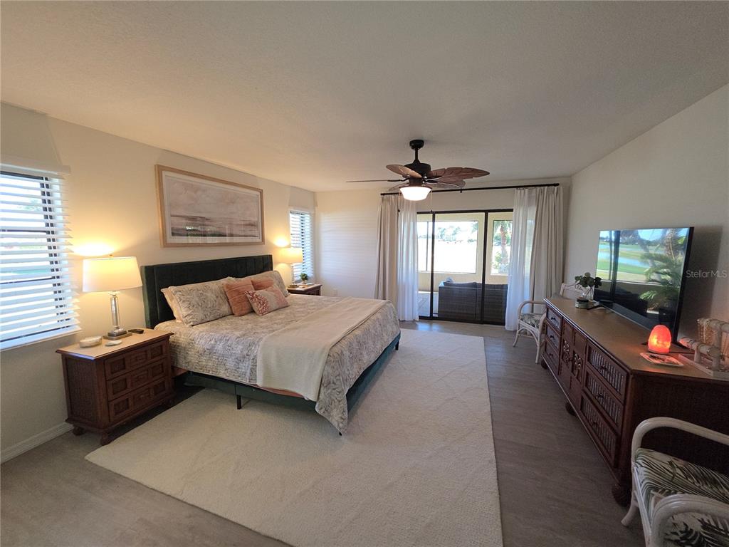 13 Seaward Circle Placida, FL 33946 - Photo 28 of 45 a bedroom with a bed and a flat screen tv