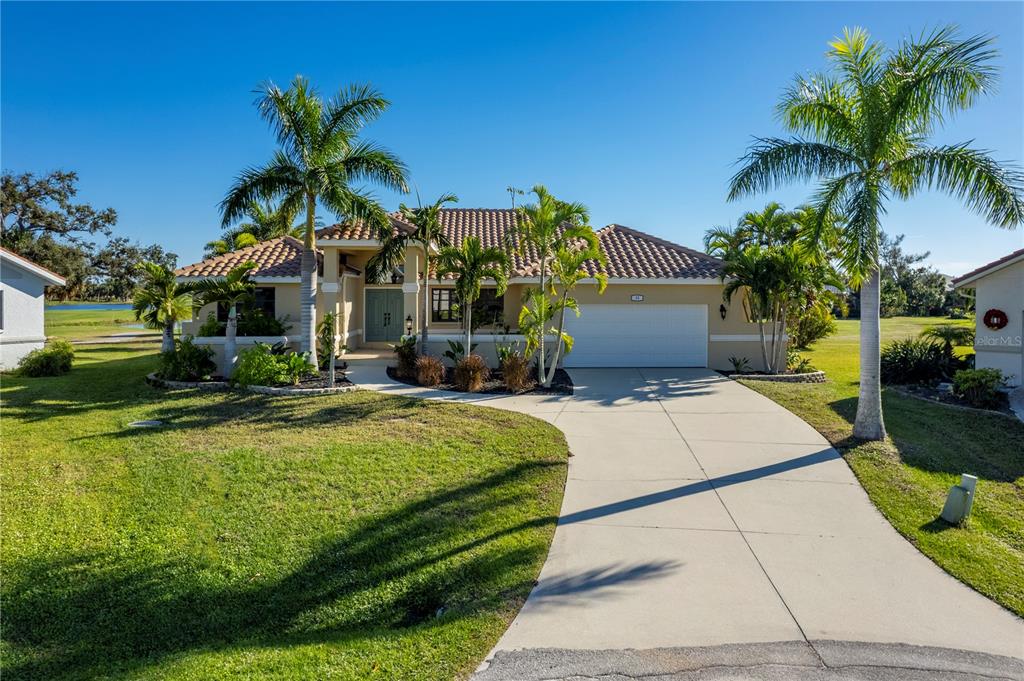 13 Seaward Circle Placida, FL 33946 - Photo 3 of 45 a front view of a house with garden