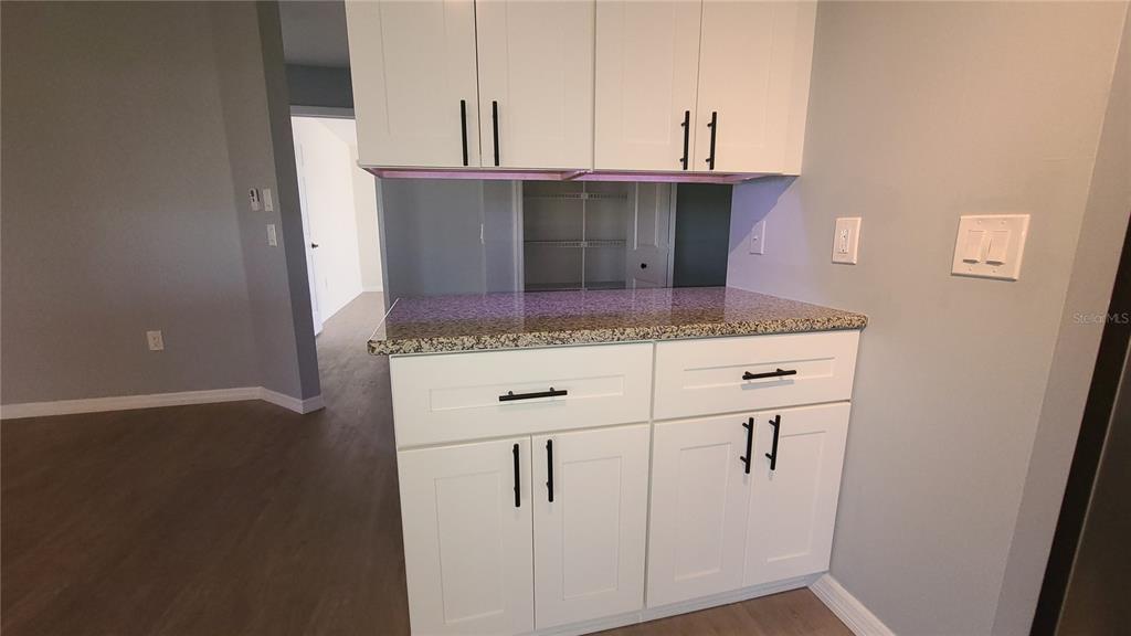 13 Seaward Circle Placida, FL 33946 - Photo 32 of 45 a kitchen with stainless steel appliances granite countertop a sink and a refrigerator