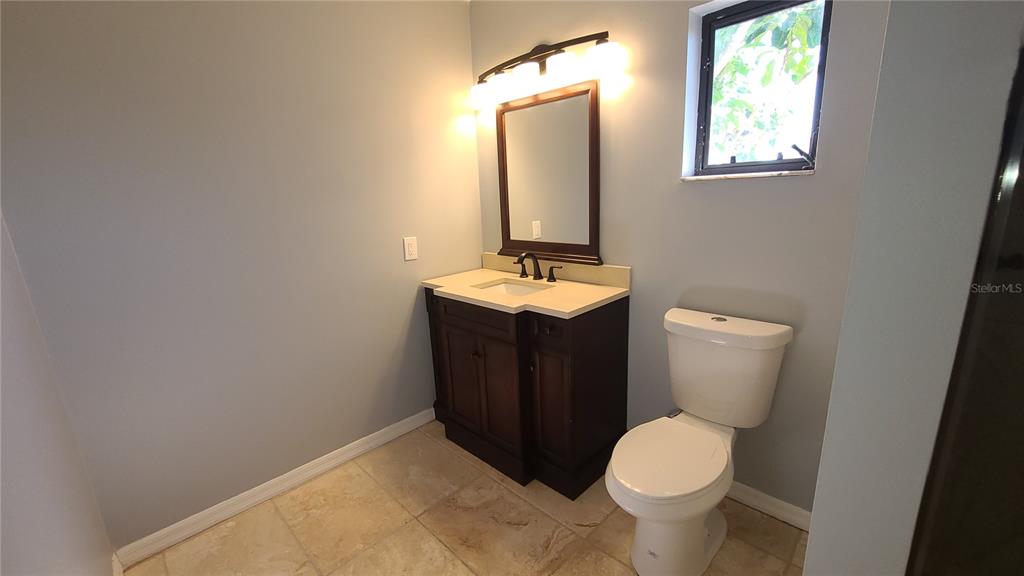13 Seaward Circle Placida, FL 33946 - Photo 33 of 45 a bathroom with a toilet sink and mirror