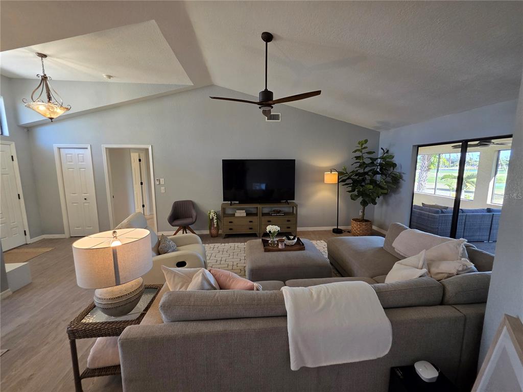 13 Seaward Circle Placida, FL 33946 - Photo 34 of 45 a living room with furniture a flat screen tv and a window