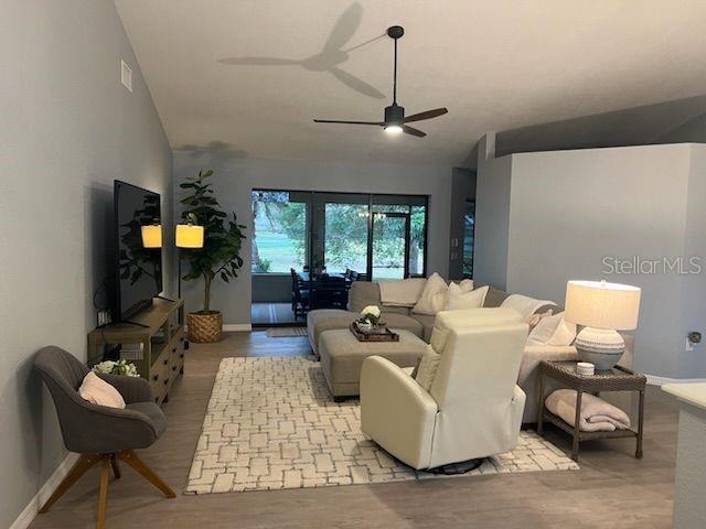 13 Seaward Circle Placida, FL 33946 - Photo 4 of 45 a living room with furniture and a chandelier