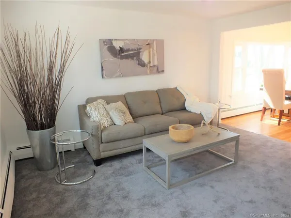 a living room with furniture and a rug