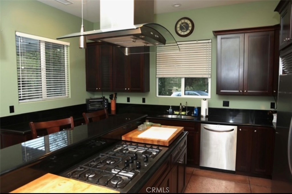 3200 San Fernando Road Atascadero, CA 93422 - Photo 13 of 45 a kitchen with a stove a sink and a microwave