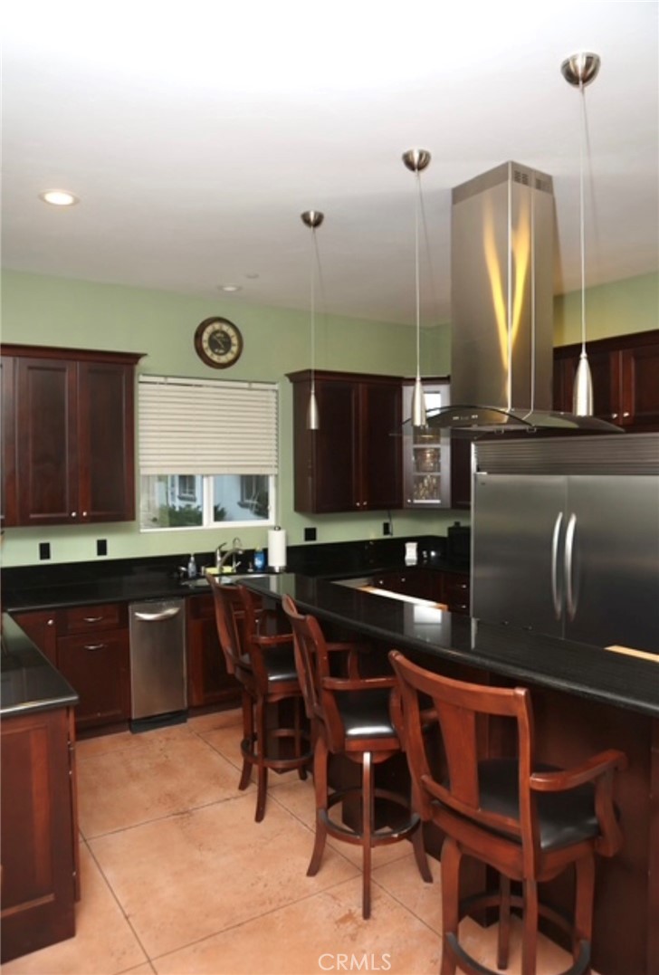3200 San Fernando Road Atascadero, CA 93422 - Photo 16 of 45 a kitchen with a table chairs sink and cabinets