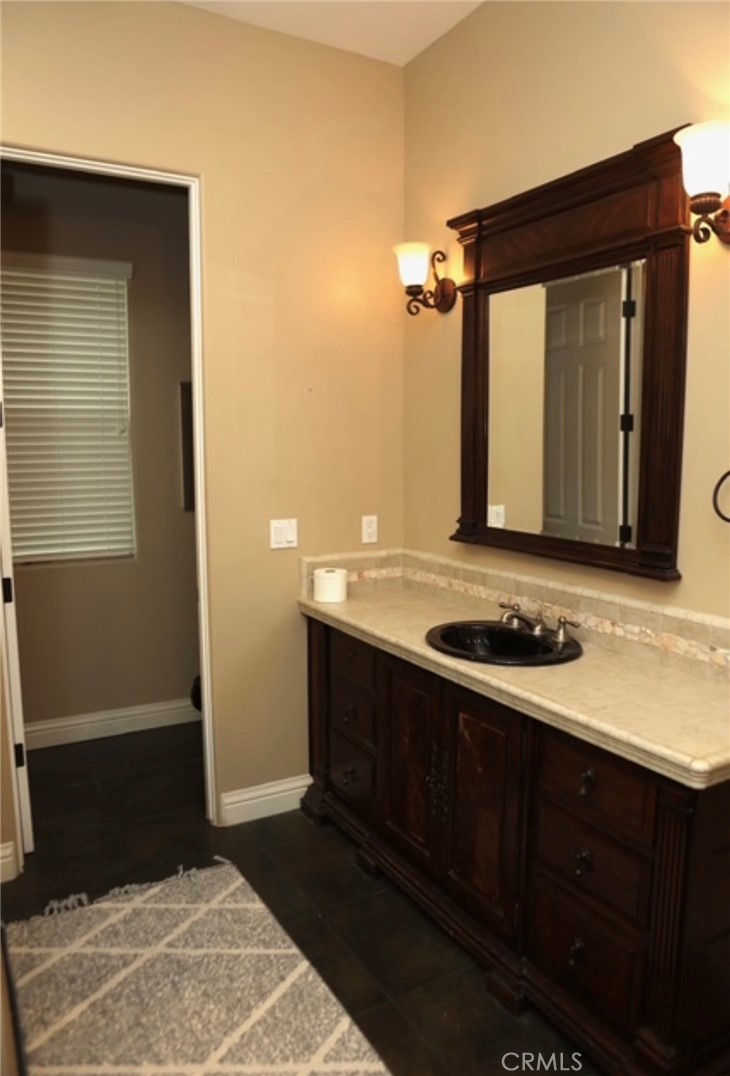 3200 San Fernando Road Atascadero, CA 93422 - Photo 30 of 45 a bathroom with a sink and a mirror