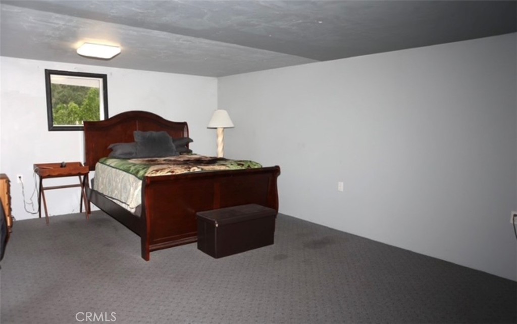 3200 San Fernando Road Atascadero, CA 93422 - Photo 42 of 45 a bedroom with a bed and a lamp on dresser