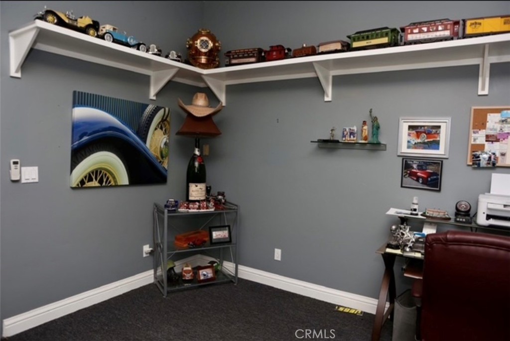 3200 San Fernando Road Atascadero, CA 93422 - Photo 8 of 45 a room with a book shelf and wooden floor