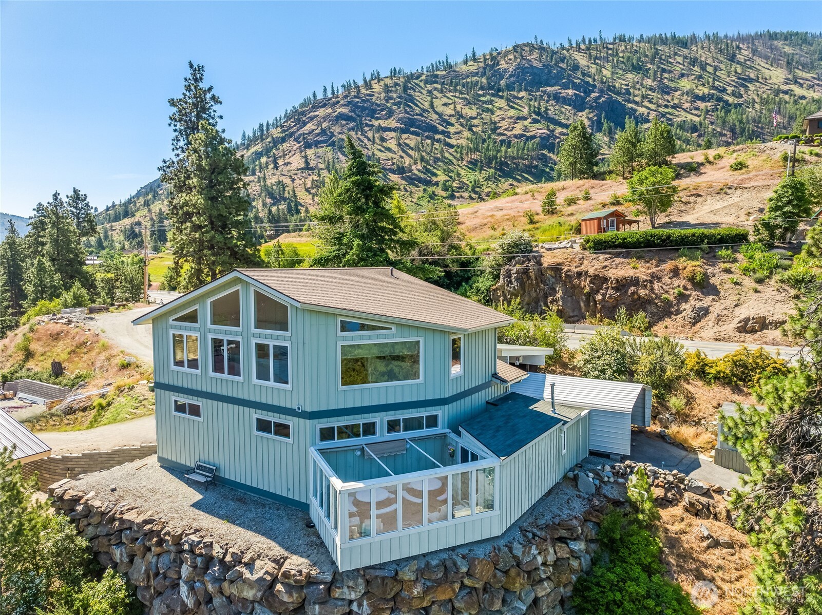 aerial view of a house with a large trees