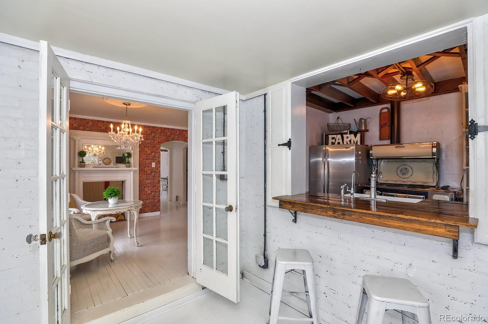 3917 Haddon Road Denver, CO 80205 - Photo 15 of 40 a room with furniture and view of living room