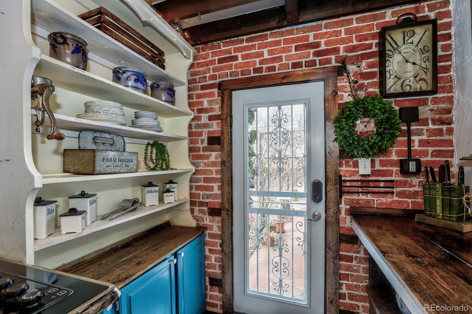 3917 Haddon Road Denver, CO 80205 - Photo 18 of 40 a front view of a building with outdoor area