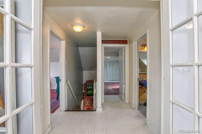 3917 Haddon Road Denver, CO 80205 - Photo 23 of 40 view of livingroom with furniture and closet