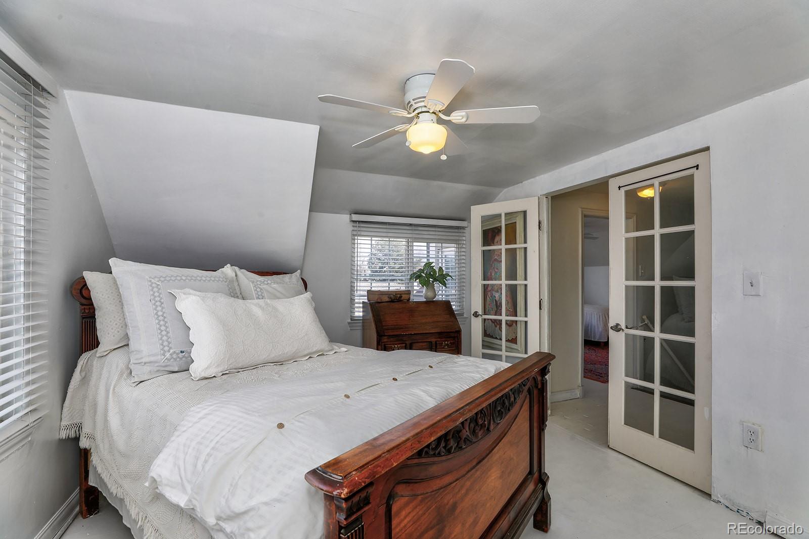 3917 Haddon Road Denver, CO 80205 - Photo 25 of 40 a bed room with a bed and a window