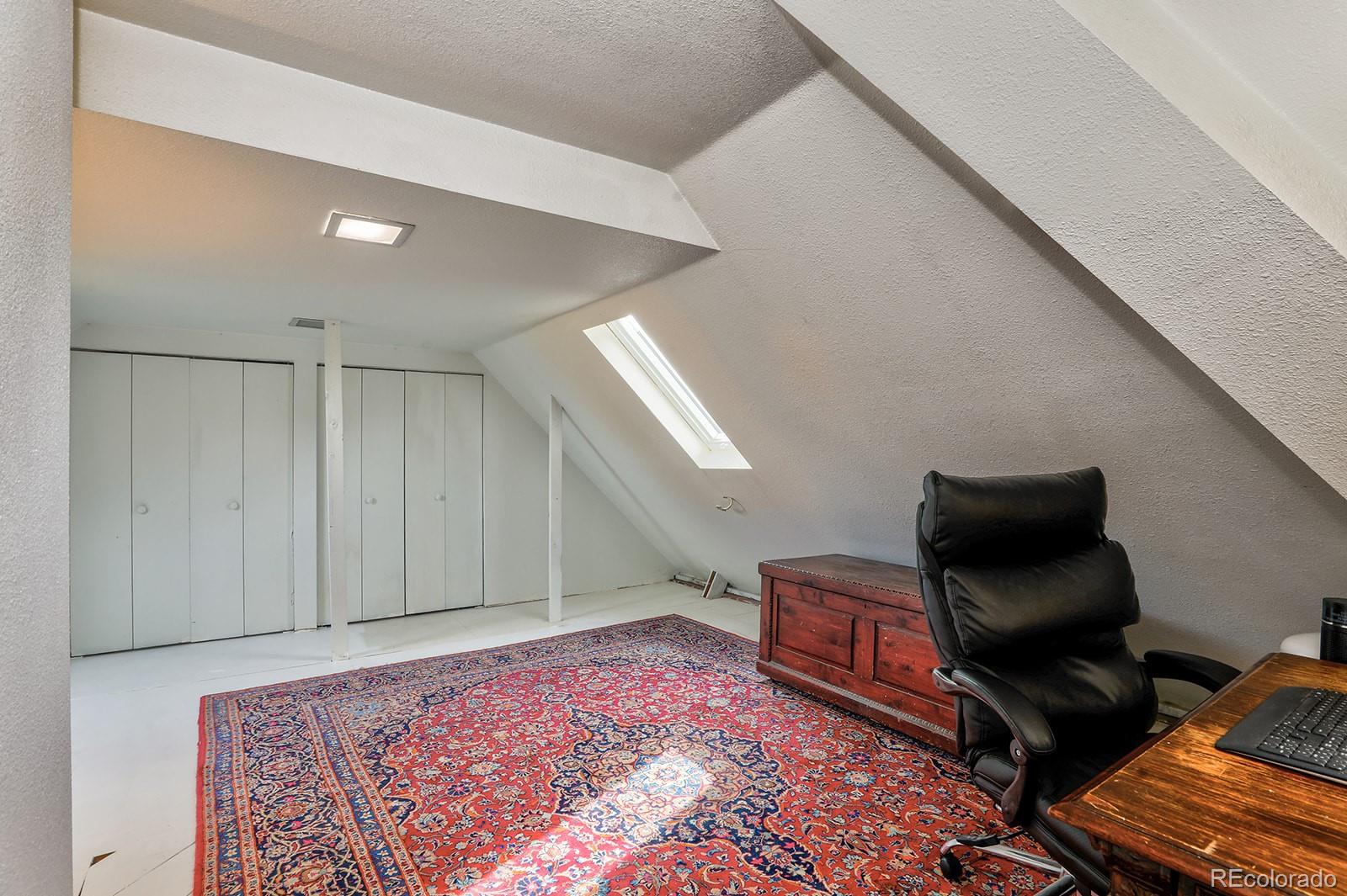 3917 Haddon Road Denver, CO 80205 - Photo 27 of 40 a living room with furniture